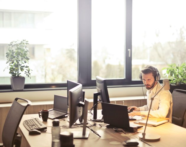 Man focused on his computer while working in the office