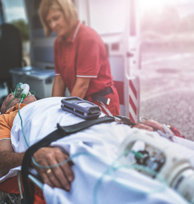 A rescue team takes a man into an ambulance