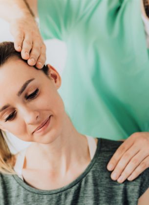 Woman sees her physio for neck pain
