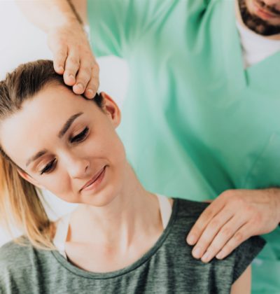 Woman sees her physio for neck pain