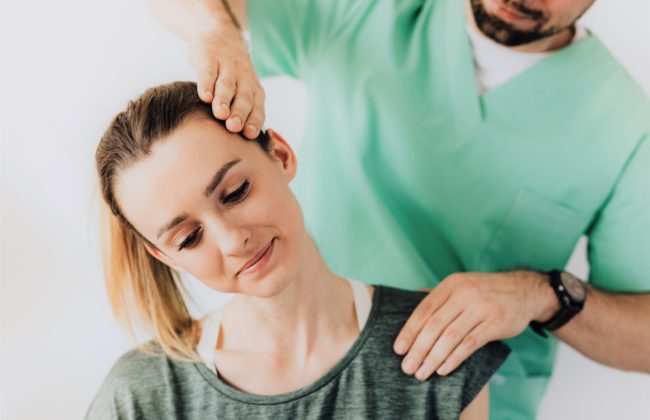 Woman sees her physio for neck pain