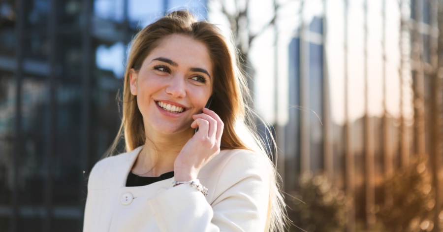 Woman smiles on phone