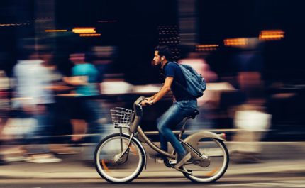 Man cycles through city