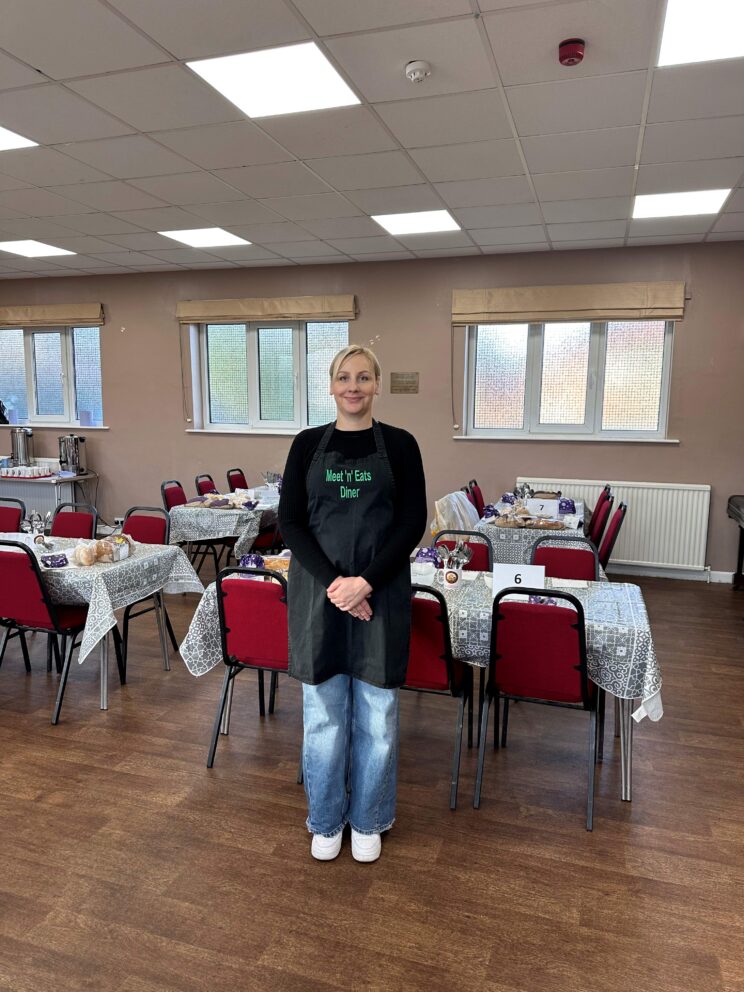 A lady standing in the diner