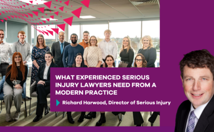 Group photo of a professional office team seated and standing in a modern workspace with large windows in the background. Overlaid magenta graphics and triangular design elements frame the image. A bold purple banner in the foreground reads: “What experienced serious injury lawyers need from a modern practice” followed by “Richard Harwood, Director of Serious Injury.” On the right side, a separate portrait headshot of a person in business attire appears against a solid purple background.