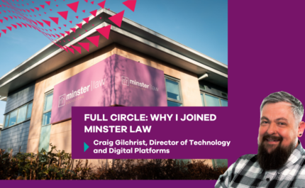 Promotional graphic showing a modern office building with a large purple sign reading “minster law solicitors” on the corner, set against a blue sky. Trees and shrubs are visible at the base, and a red triangular pattern overlays the top left. In the foreground, a purple text panel reads: “FULL CIRCLE: WHY I JOINED MINSTER LAW” with smaller text below: “Craig Gilchrist, Director of Technology and Digital Platforms.” On the right, a cut-out headshot shows a person wearing a check shirt, with a beard, positioned against a purple background.